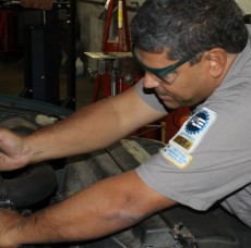 A mechanic fixing a car’s engine